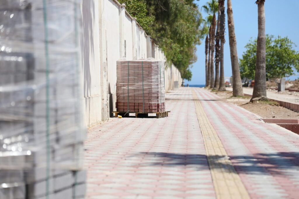 Paving stones on wooden pallet on the street sidewalk